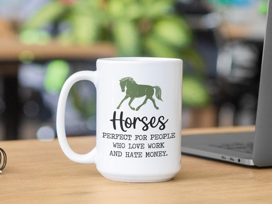 a white coffee mug sitting on top of a wooden table