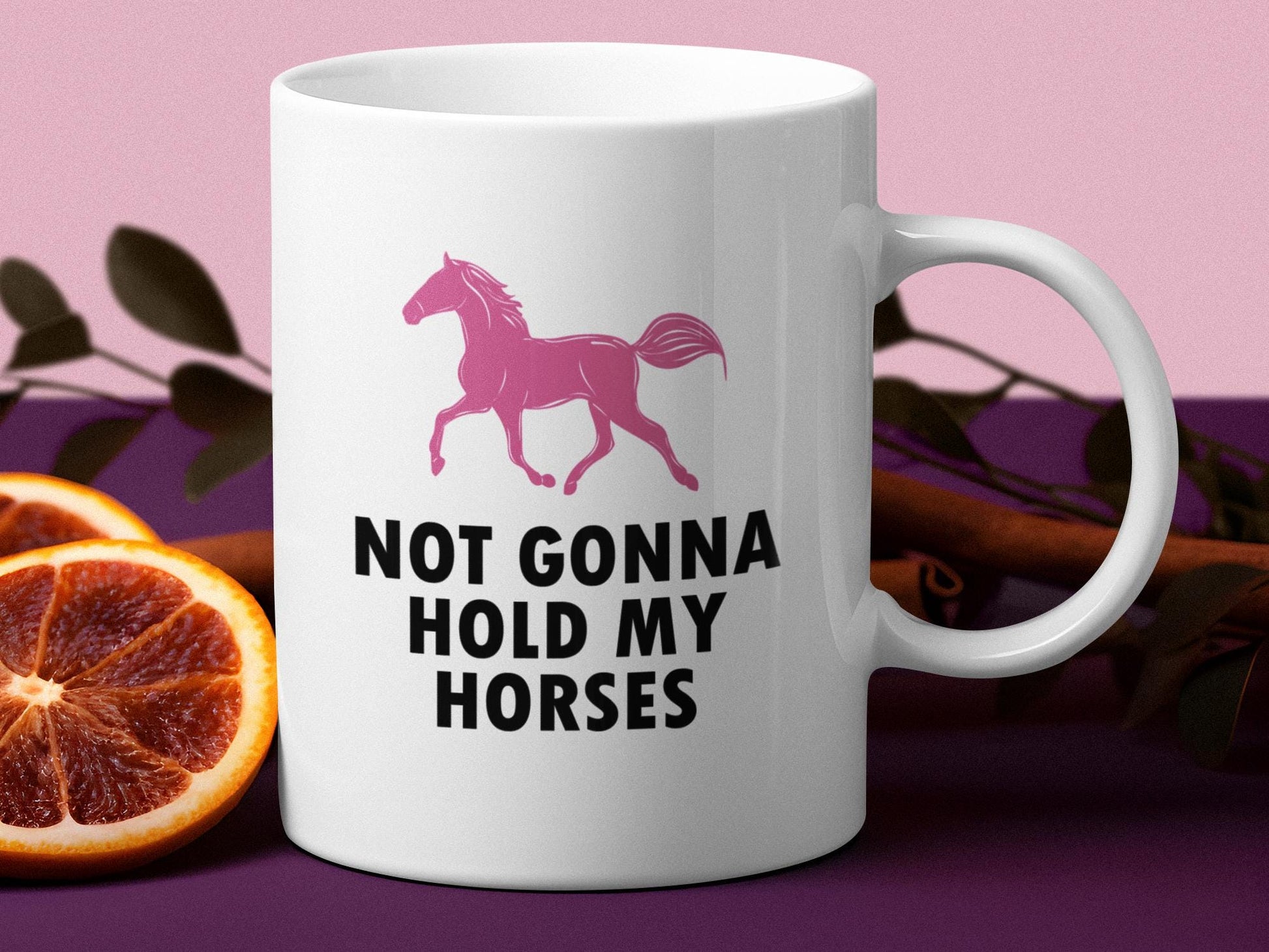 a white coffee mug with a pink horse on it