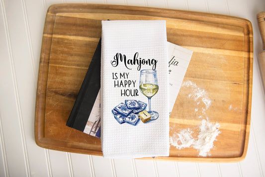 White waffle weave towel with image of wineglass beverage next to Mahjong tiles, phrase with &quot;Mahjong is my happy hour&quot; above