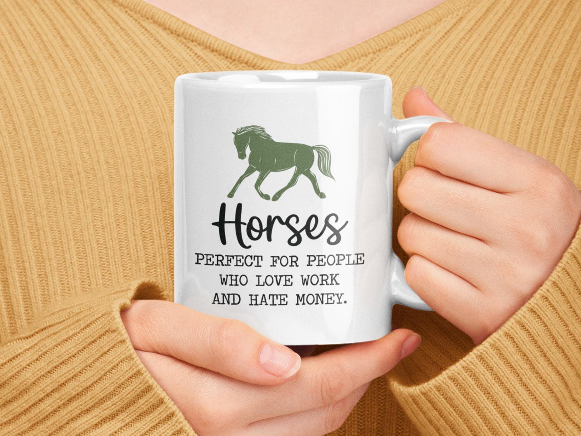 a woman holding a coffee mug with a horse on it