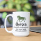 a white coffee mug sitting on top of a wooden table