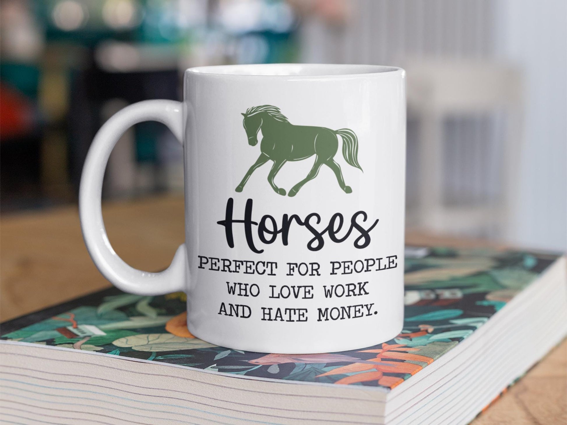 a coffee mug sitting on top of a book