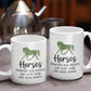 two white coffee mugs with horses on them