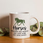 a white coffee mug with a horse on it