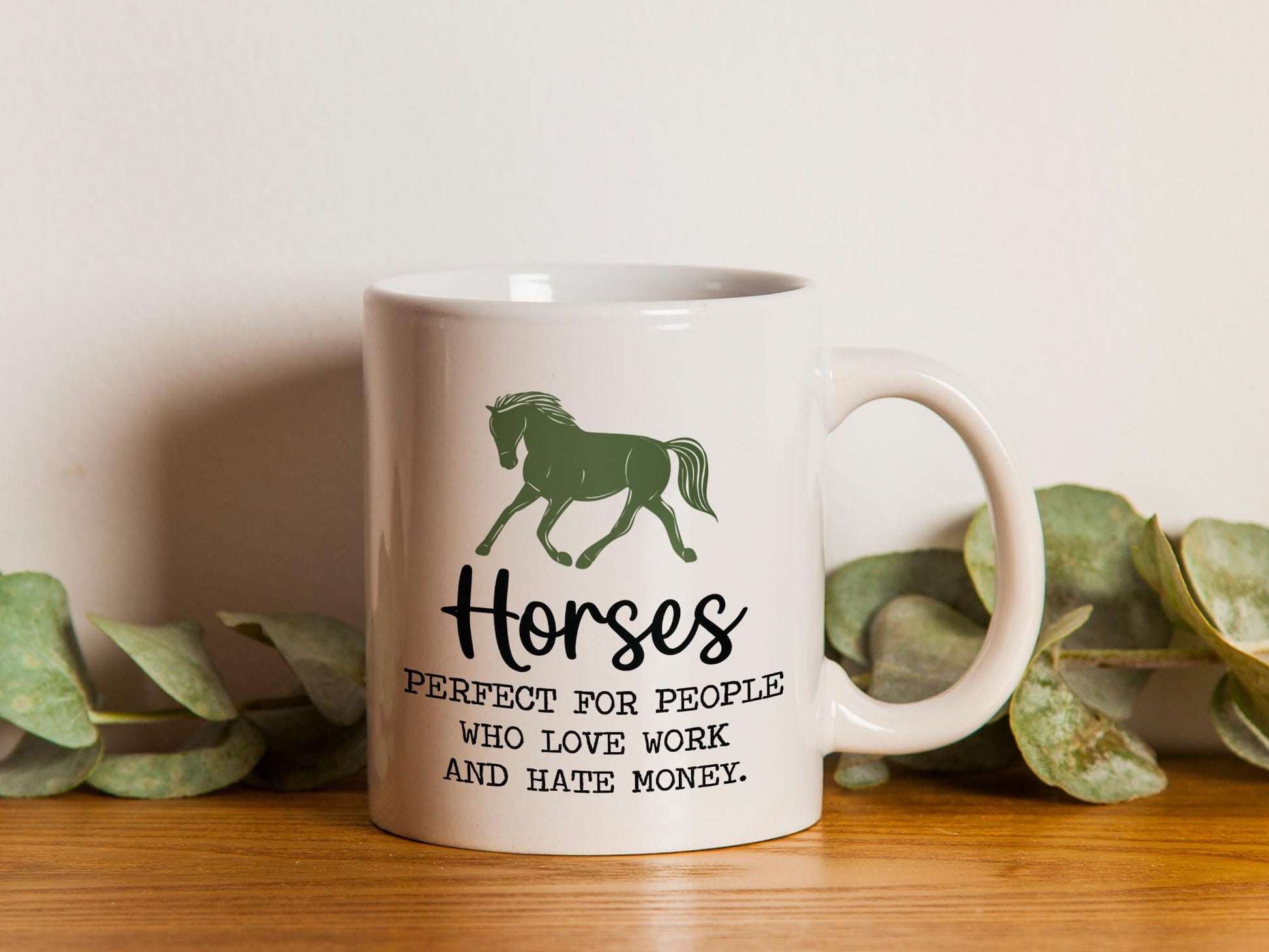 a white coffee mug with a horse on it