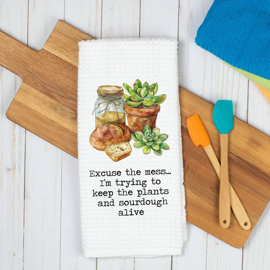 High-quality waffle weave kitchen towel featuring charming sourdough design. Perfect for adding rustic charm to your kitchen decor. Ideal for drying dishes or hands. Durable and absorbent. Elevate your kitchen with this artisanal touch!