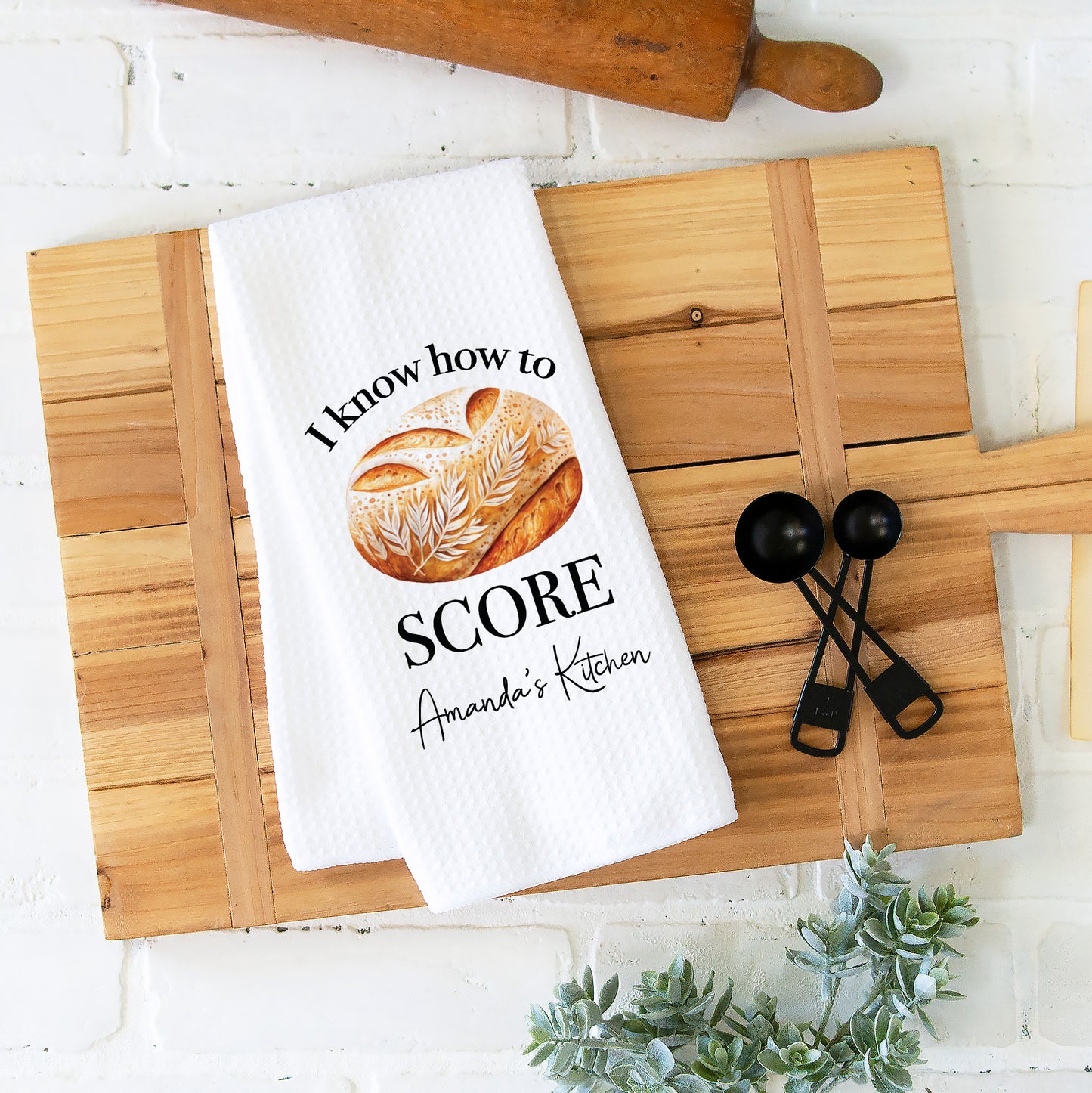 High-quality waffle weave kitchen towel featuring charming sourdough design. Perfect for adding rustic charm to your kitchen decor. Ideal for drying dishes or hands. Durable and absorbent. Elevate your kitchen with this artisanal touch!