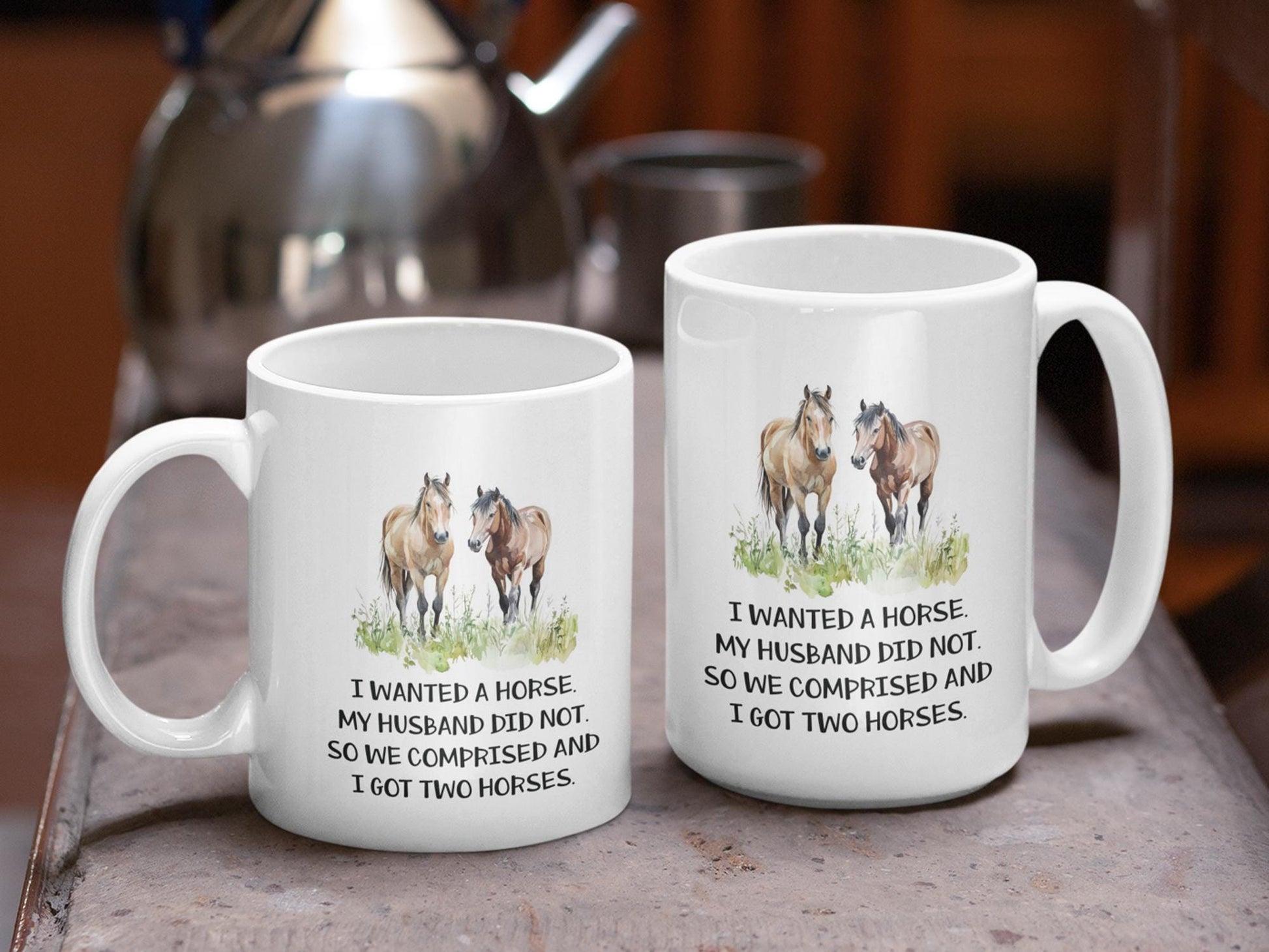 two white coffee mugs with horses on them