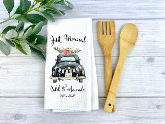 just married kitchen towel on gray wood background with wooden utensils